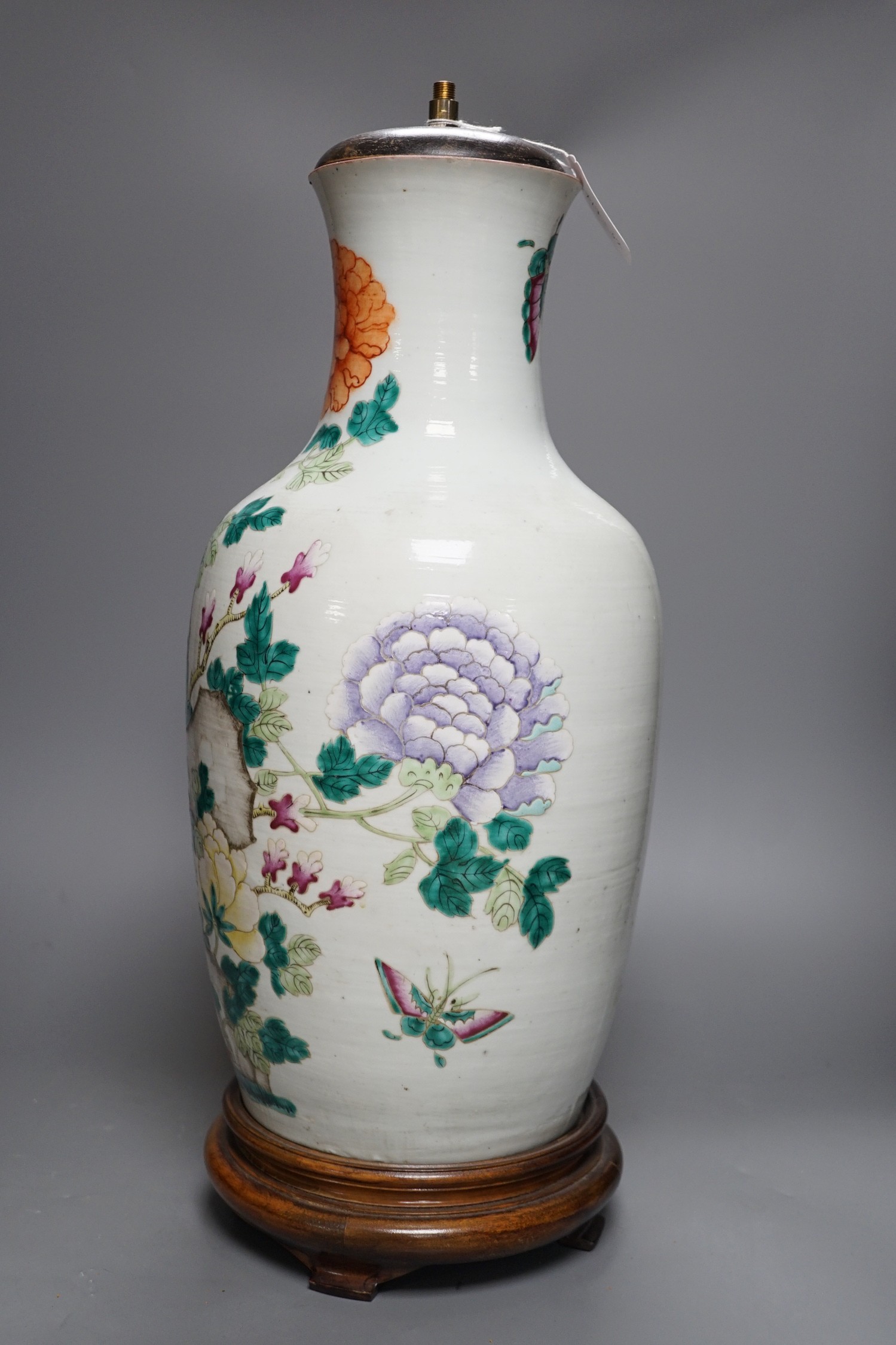 A large Chinese famille rose ‘peony and rockwork’ vase, converted into a lamp on wooden base, 53cm tall